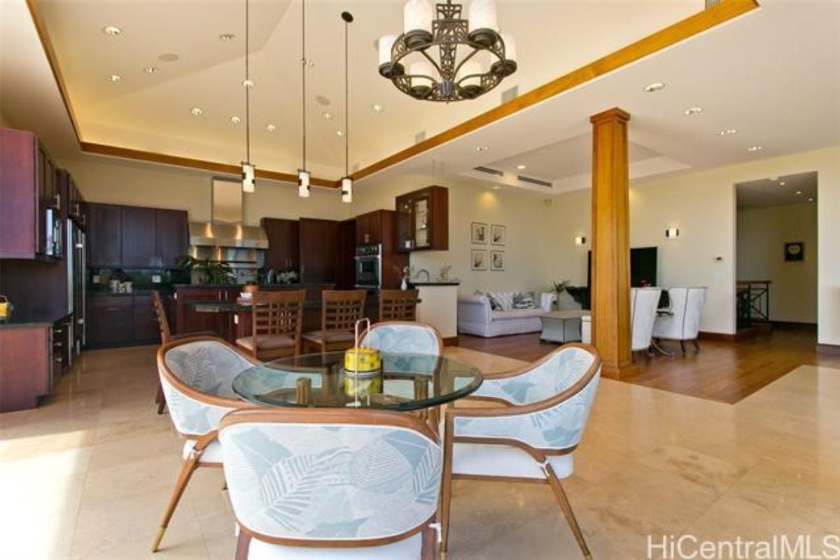 A great room with living space, a dining area, and a kitchen.