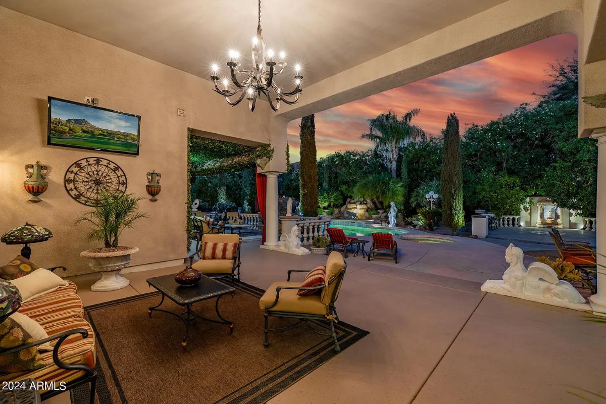 Outdoor living space with a chandelier.