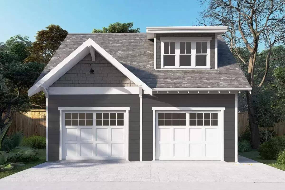 Front view with 2-car garage and a large shed dormer.