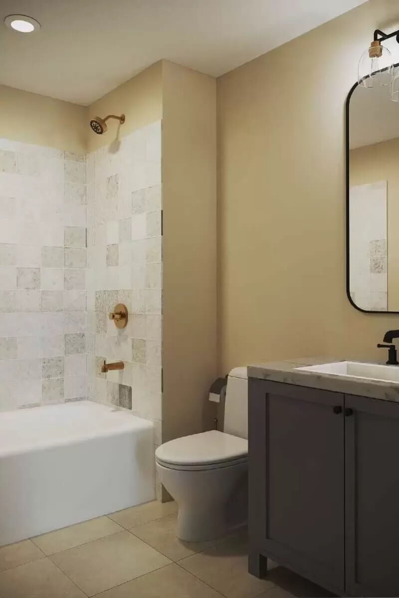 Bathroom with a sink vanity and a tub and shower combo.