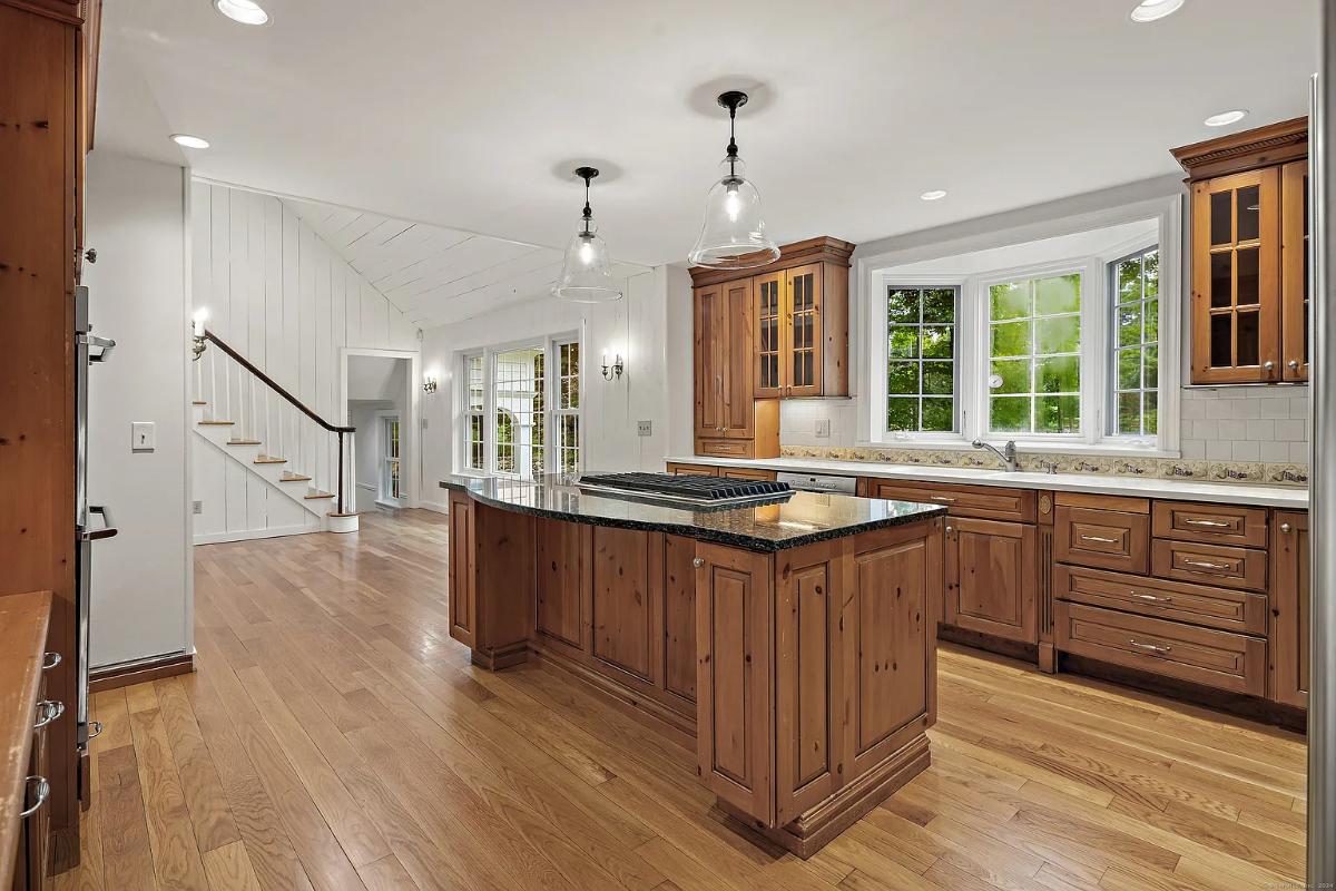 Kitchen with custom cabinetry and a center island prep area.