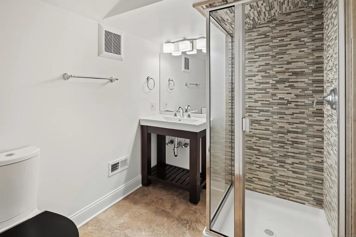 Bathroom with a sink and a walk-in shower.