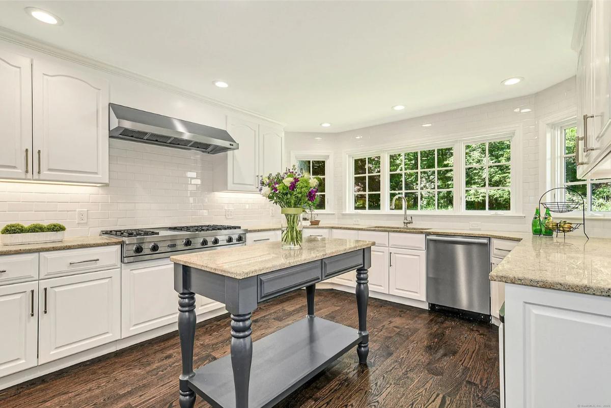 Kitchen with custom cabinetry and a center prep area.