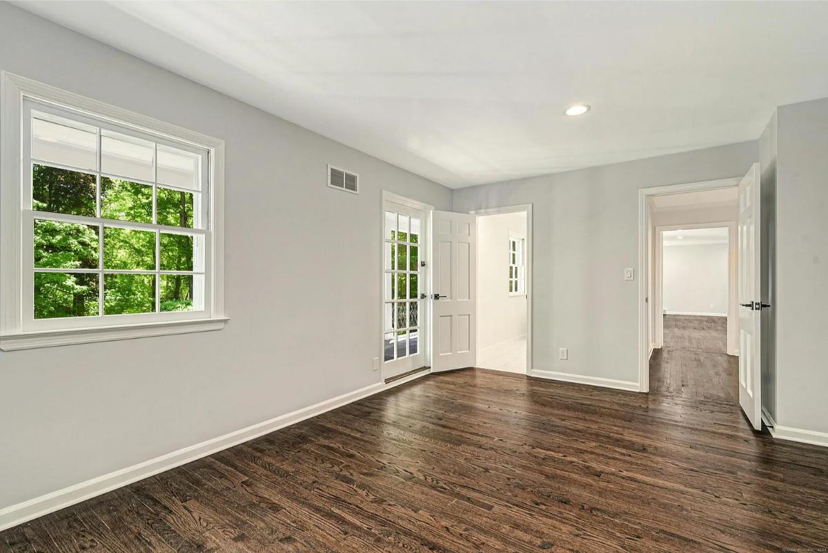 Bedroom with hardwood floors.