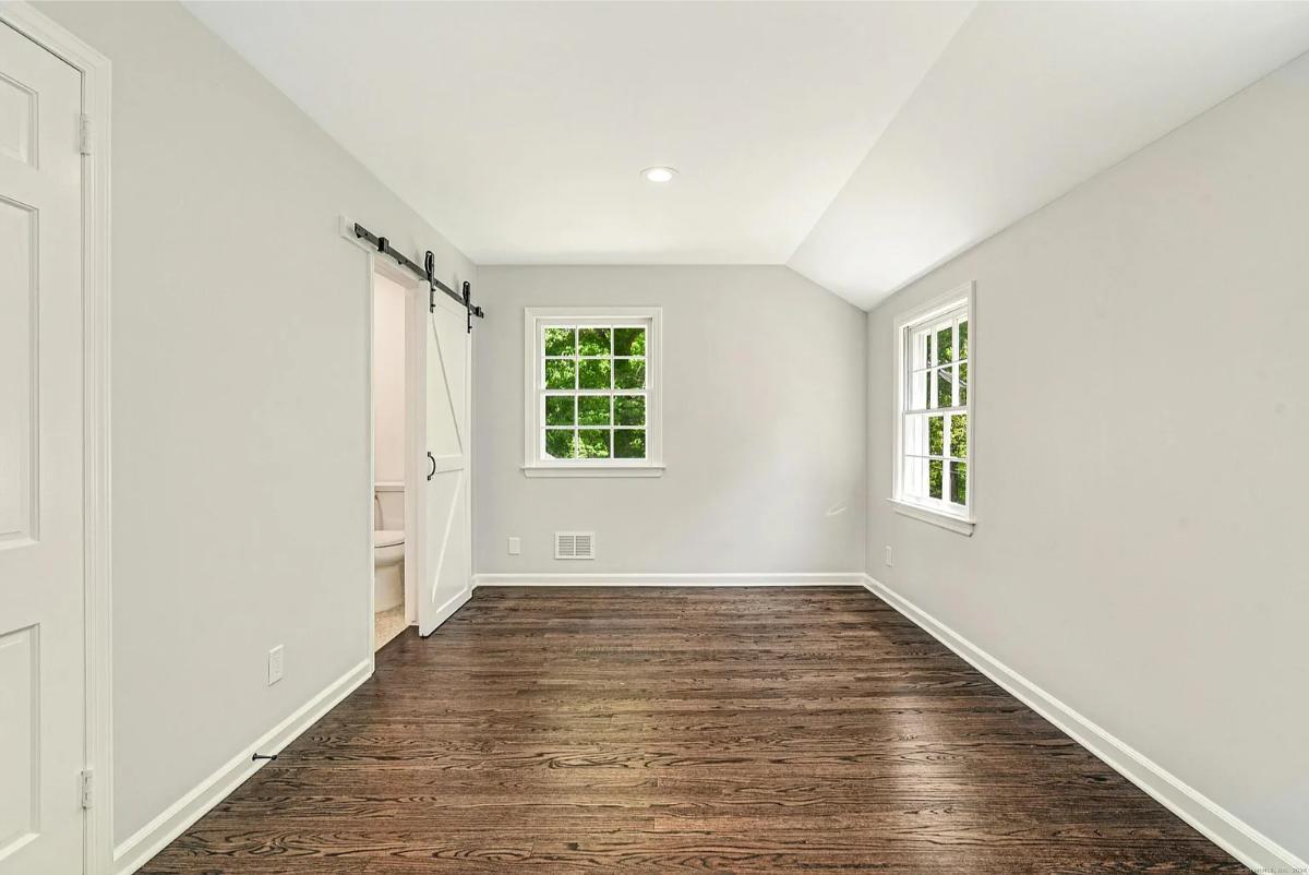 Bedroom with hardwood floors.