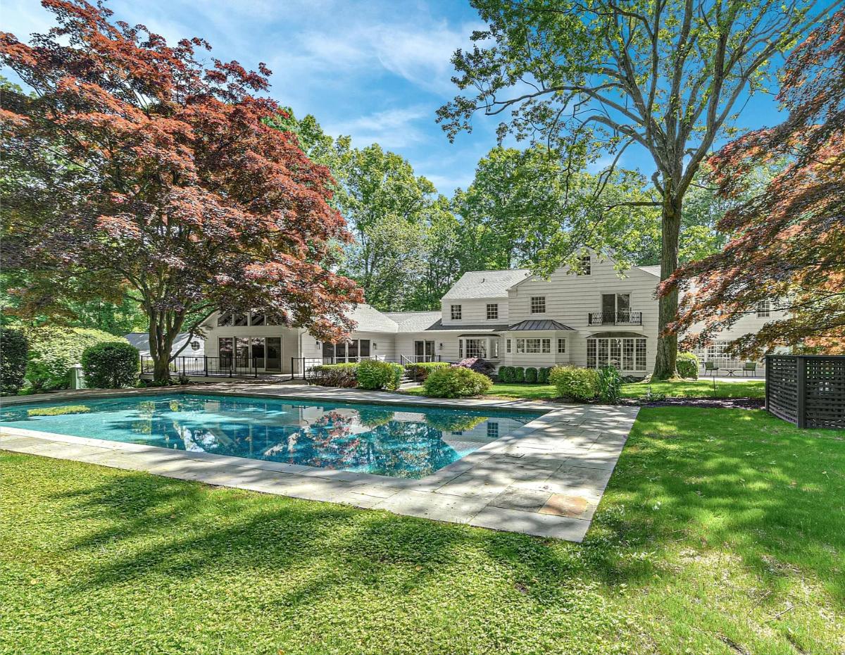 Rear view of the house with a pool.