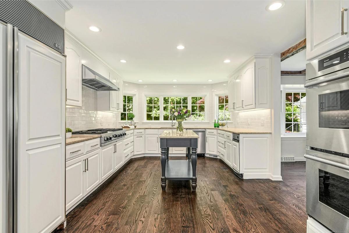 Kitchen with custom cabinetry and a center prep area.