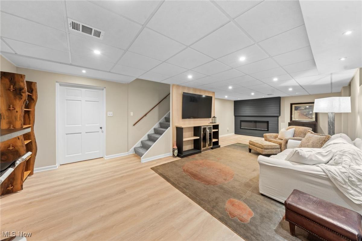 Family room with couches and a fireplace.