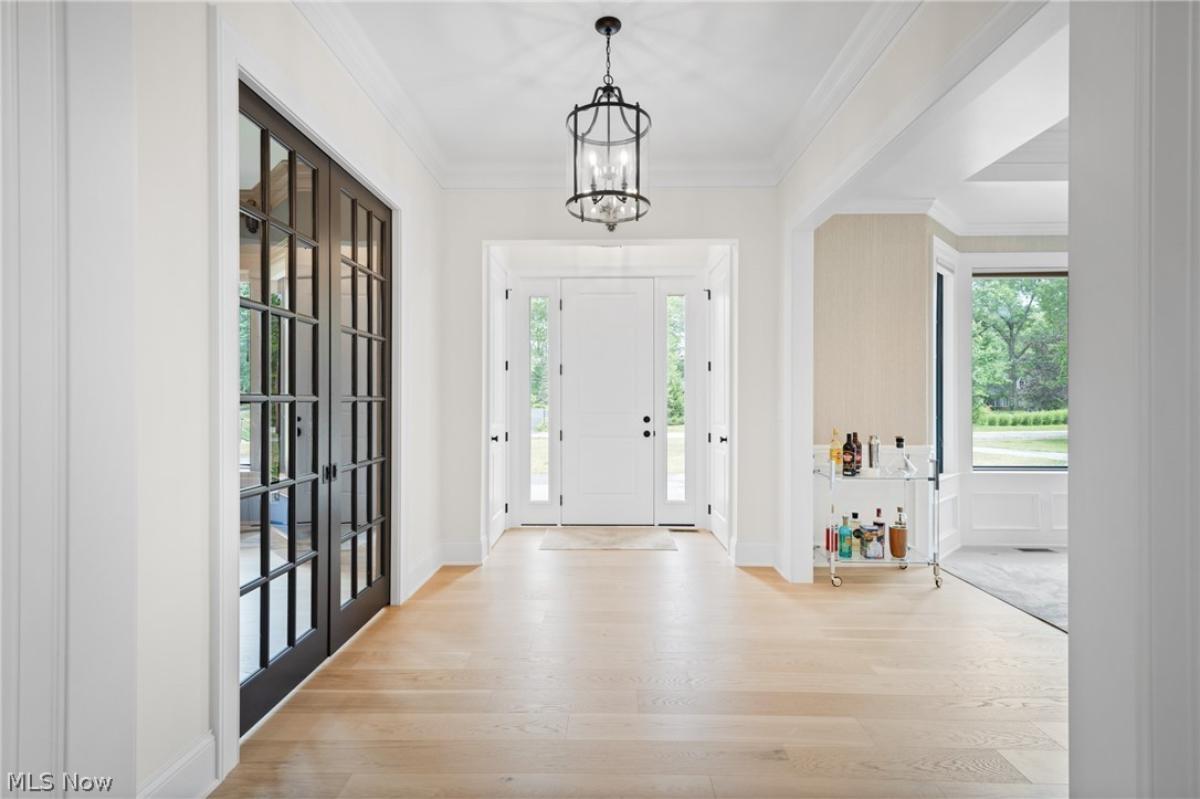 Foyer with hardwood floors.