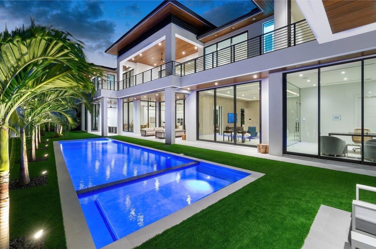 Backyard of the mansion with a pool.
