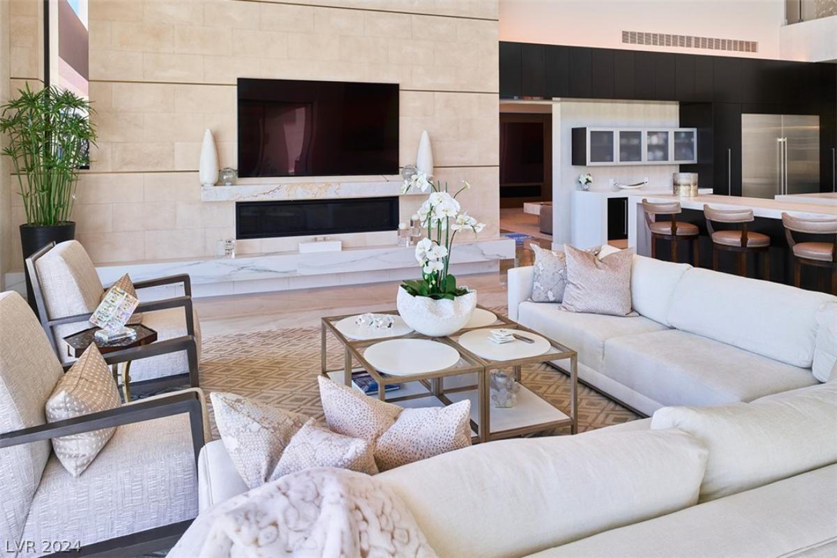 Living room with couches and a TV.