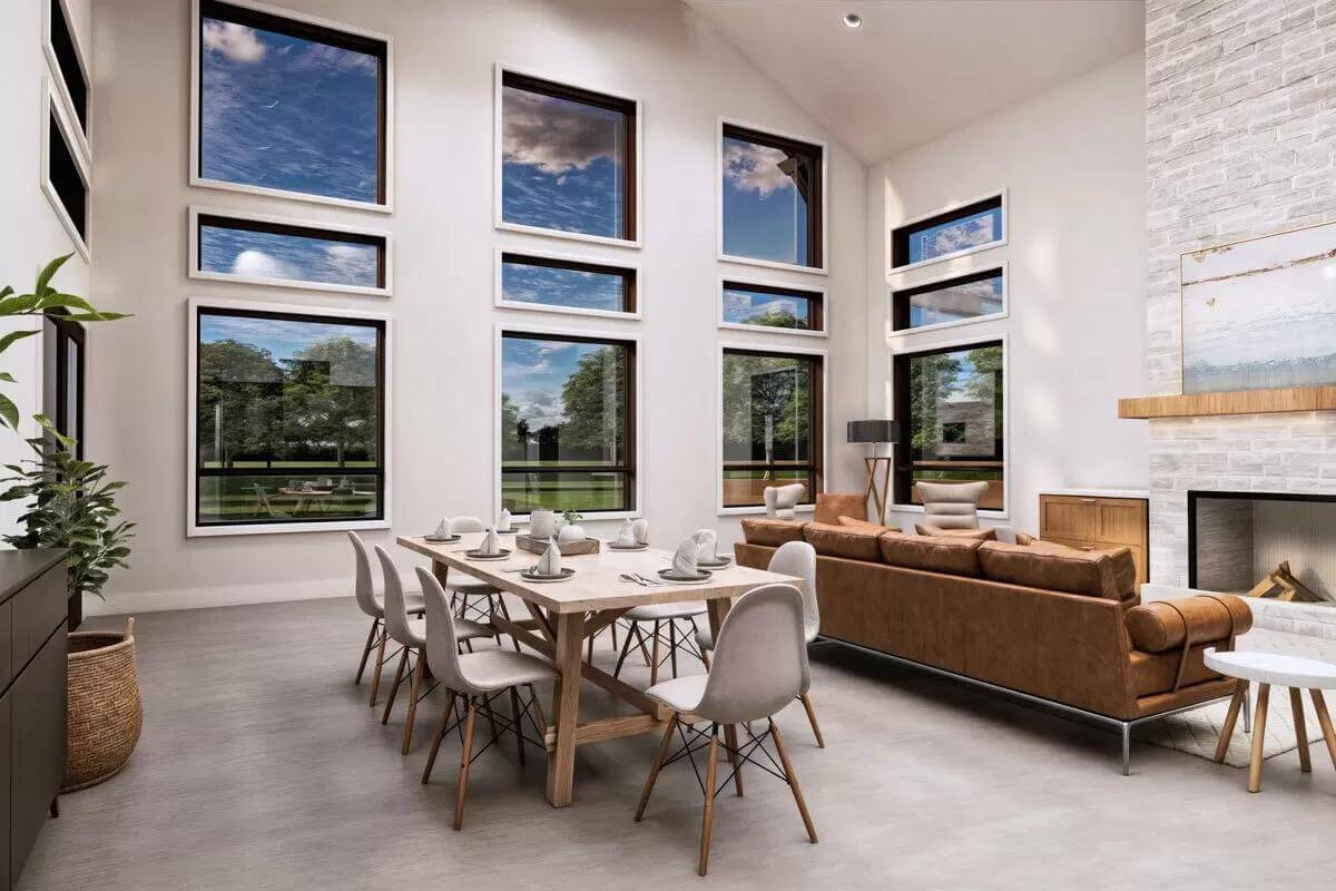 Dining area with a light wood table surrounded by modern chairs.