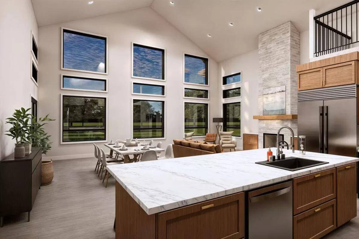 Kitchen island with a prep sink overlooking the dining and living rooms.