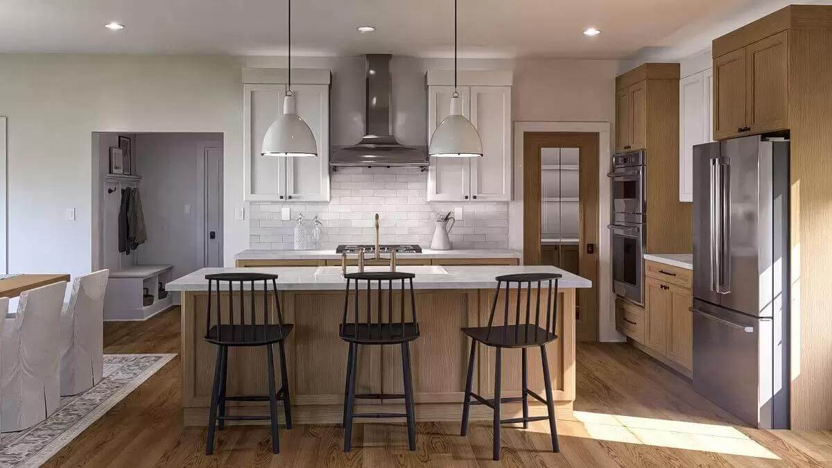 Kitchen with white and wood cabinets, stainless steel appliances, and a breakfast island illuminated by a couple of pendants.