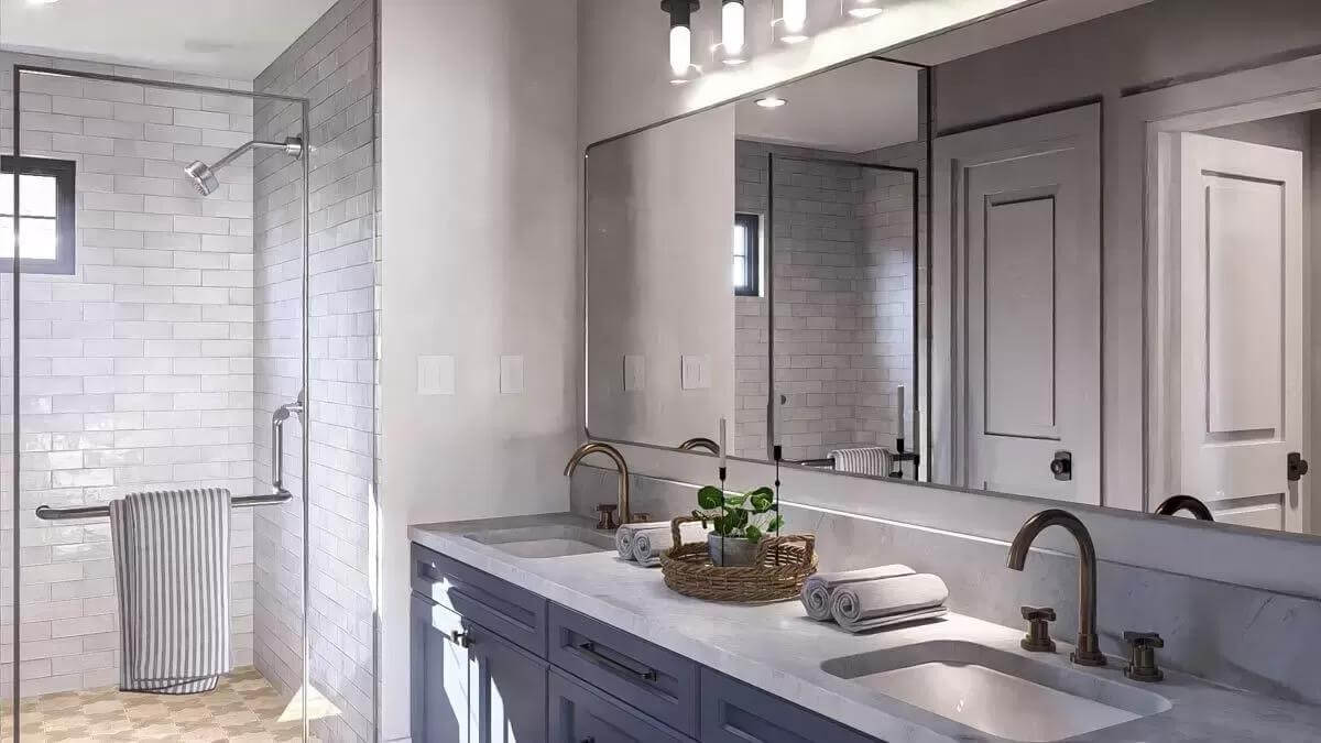 Primary bathroom with a dual sink vanity and a tiled shower.