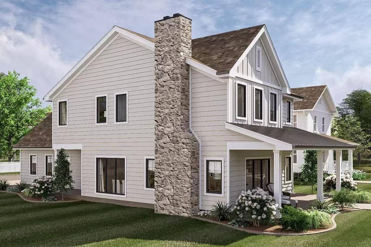 Front-left view with a stone chimney and a covered entry porch.