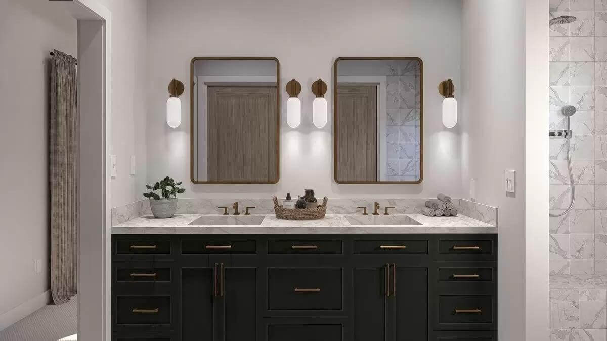 Primary bathroom with a dual sink vanity and a tiled shower.