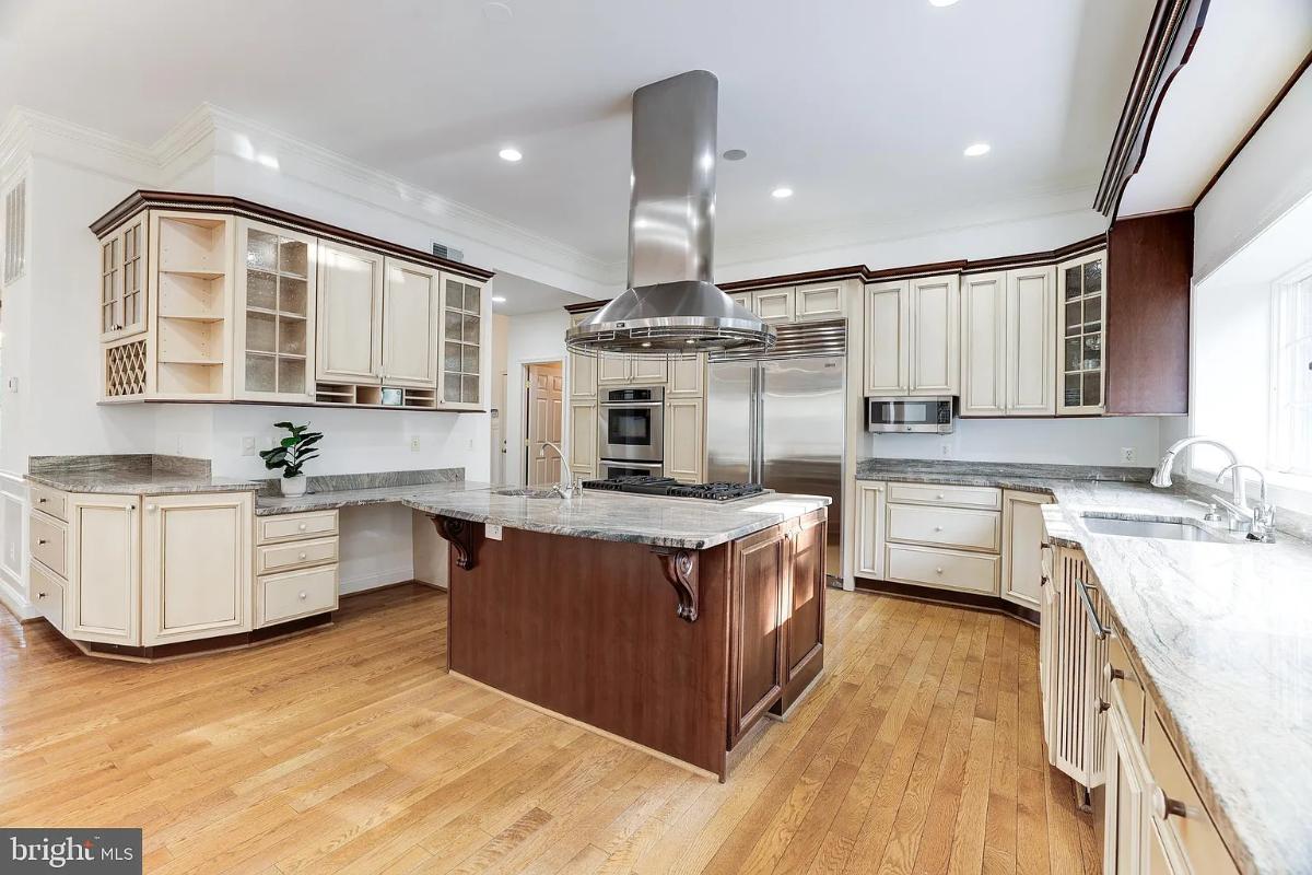 Kitchen with a custom cabinetry and a center island prep area.