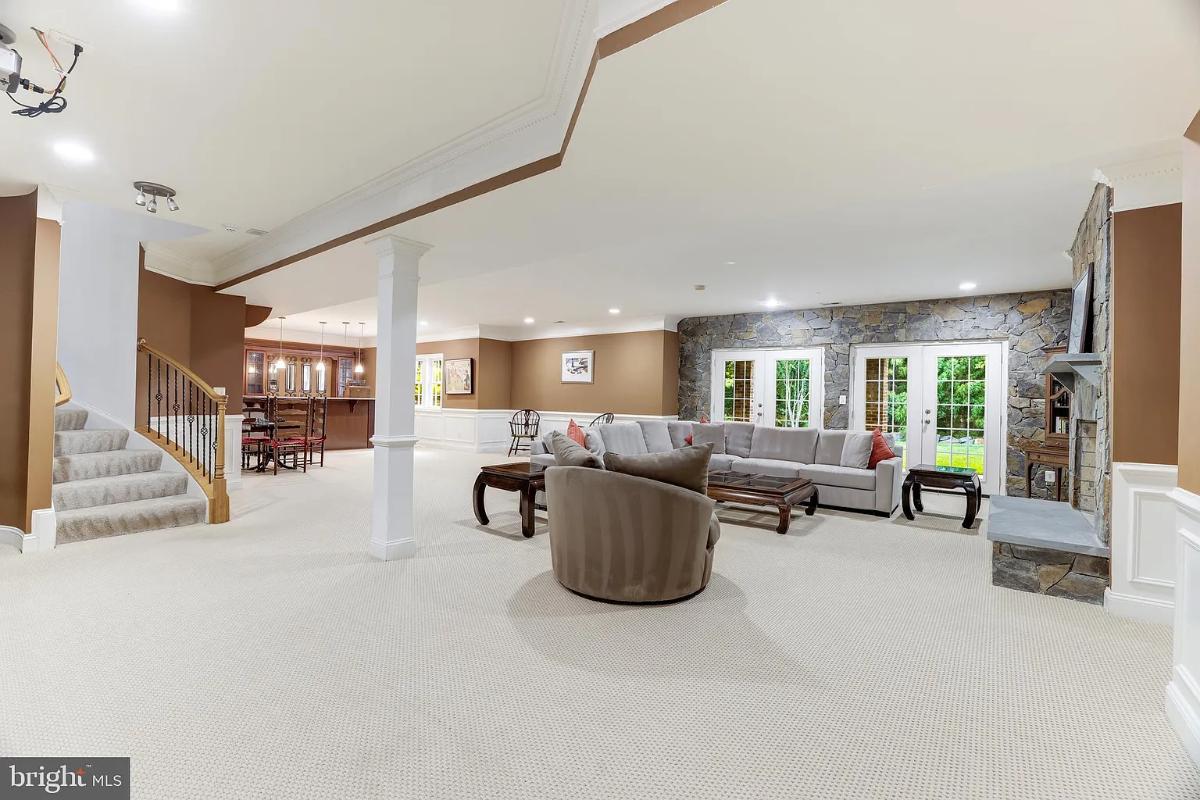Recreation room with couches and a bar.