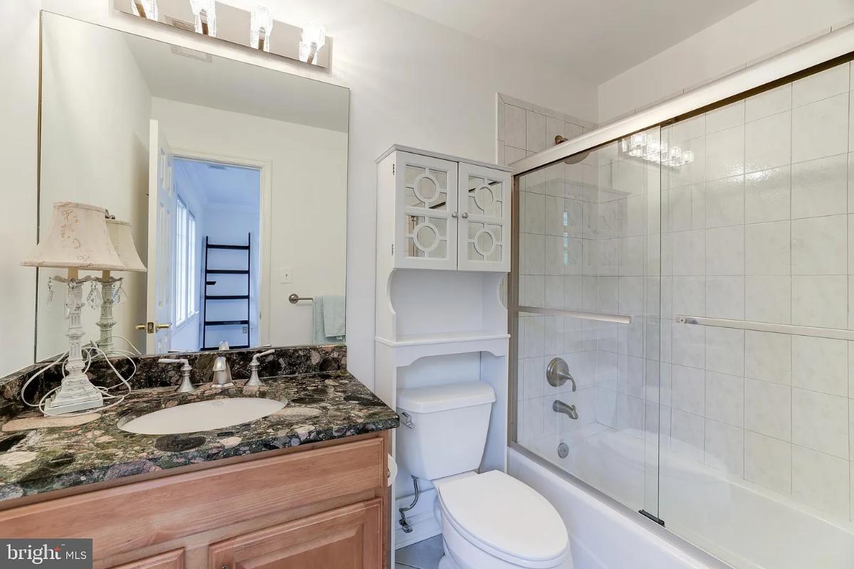Bathroom with a sink, toilet and a shower.