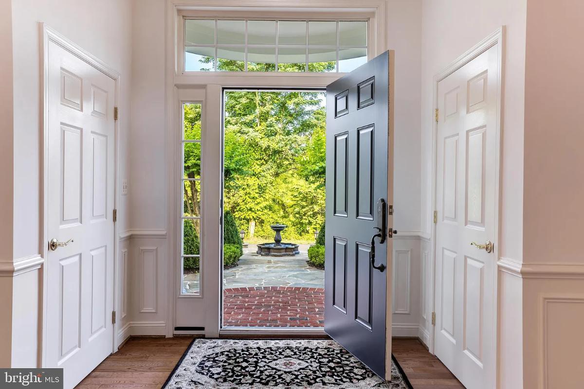 Foyer with a hardwood door.