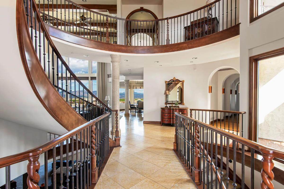 Foyer showcasing the winding staircase and balcony.