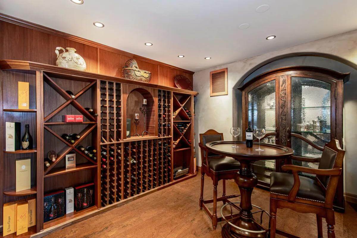 Wine cellar with built-in racks and a round tasting table.