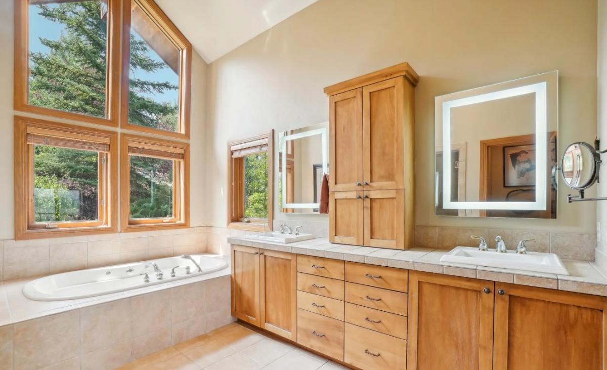 Bathroom with a custom-made vanity and a soaking tub.