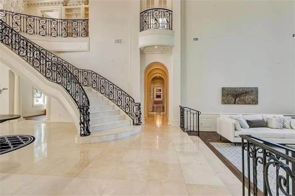 Majestic staircase with elegant wrought iron railing