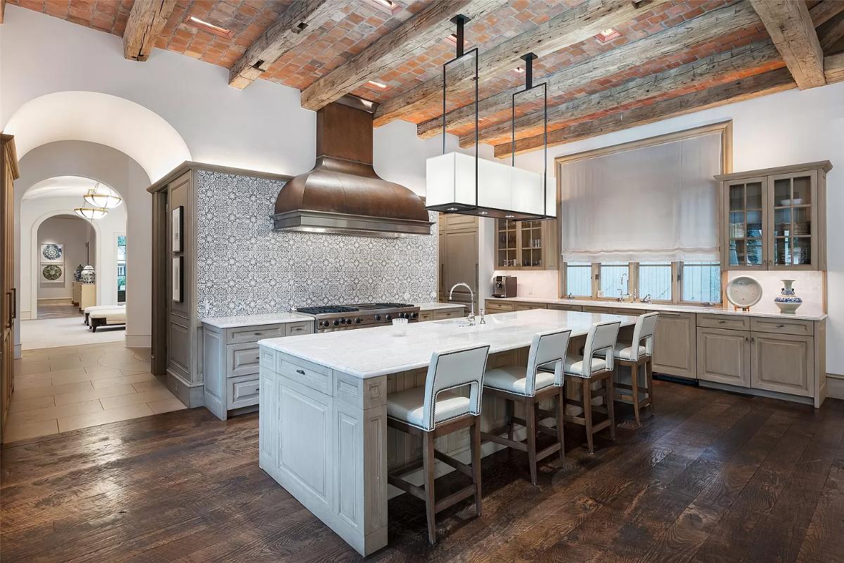 Kitchen with custom cabinetry and a counter breakfast bar.