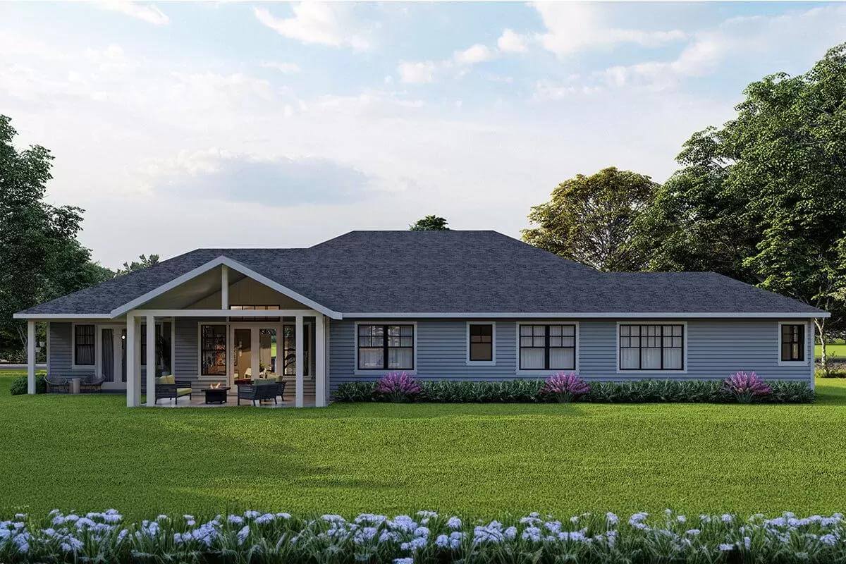 Rear view with plenty of windows and covered patios.