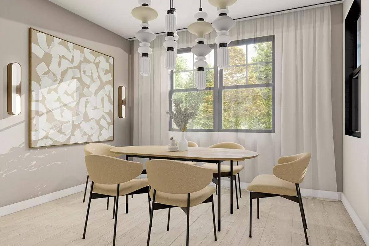 Dining room with an oval dining set illuminated by bulb pendants and white-framed windows.