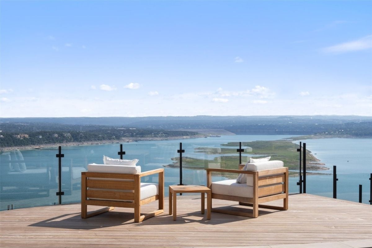 A deck with chairs and a coffee table.