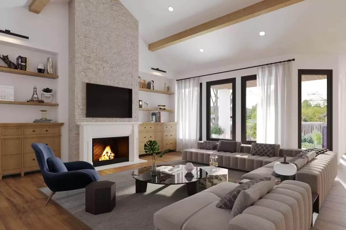 Great room with modern sofas and a fireplace topped by a TV.