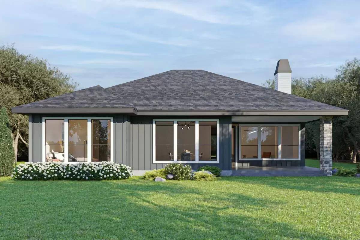 Rear view with white-framed windows and a covered pavilion.
