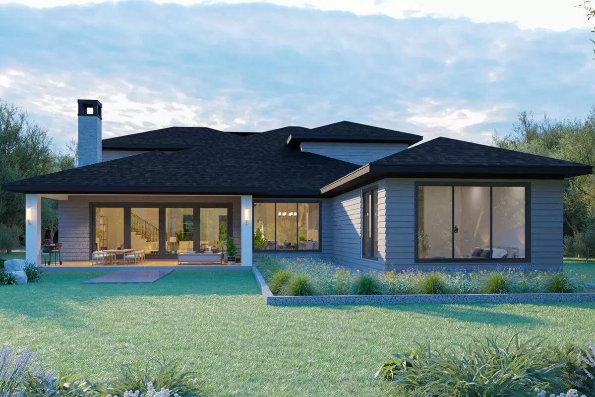 Rear view showcasing the covered porch with outdoor kitchen.