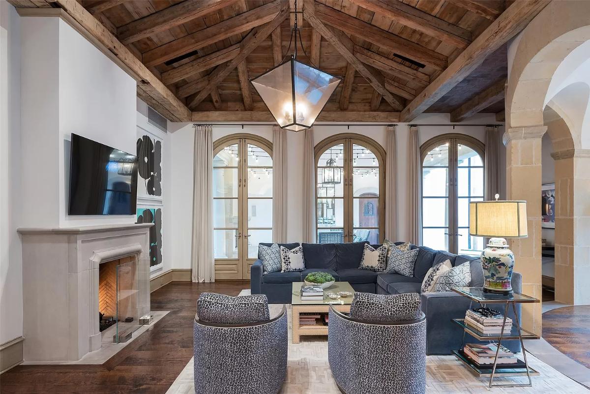 Living room with a fireplace and hardwood floors.