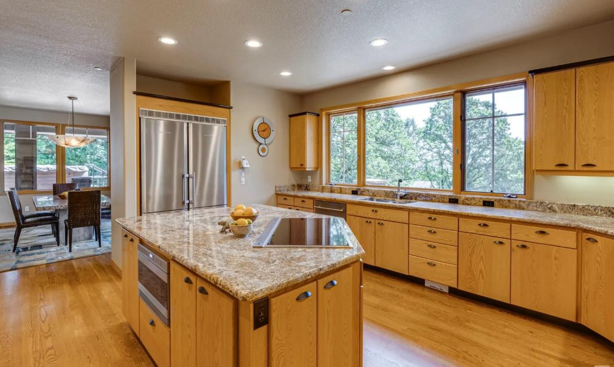Kitchen with custom cabinetry and a center island prep area.
