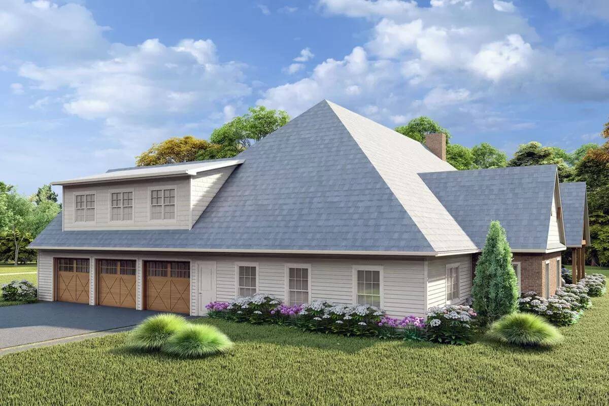 Right view with 3-car garage topped by a large shed dormer.