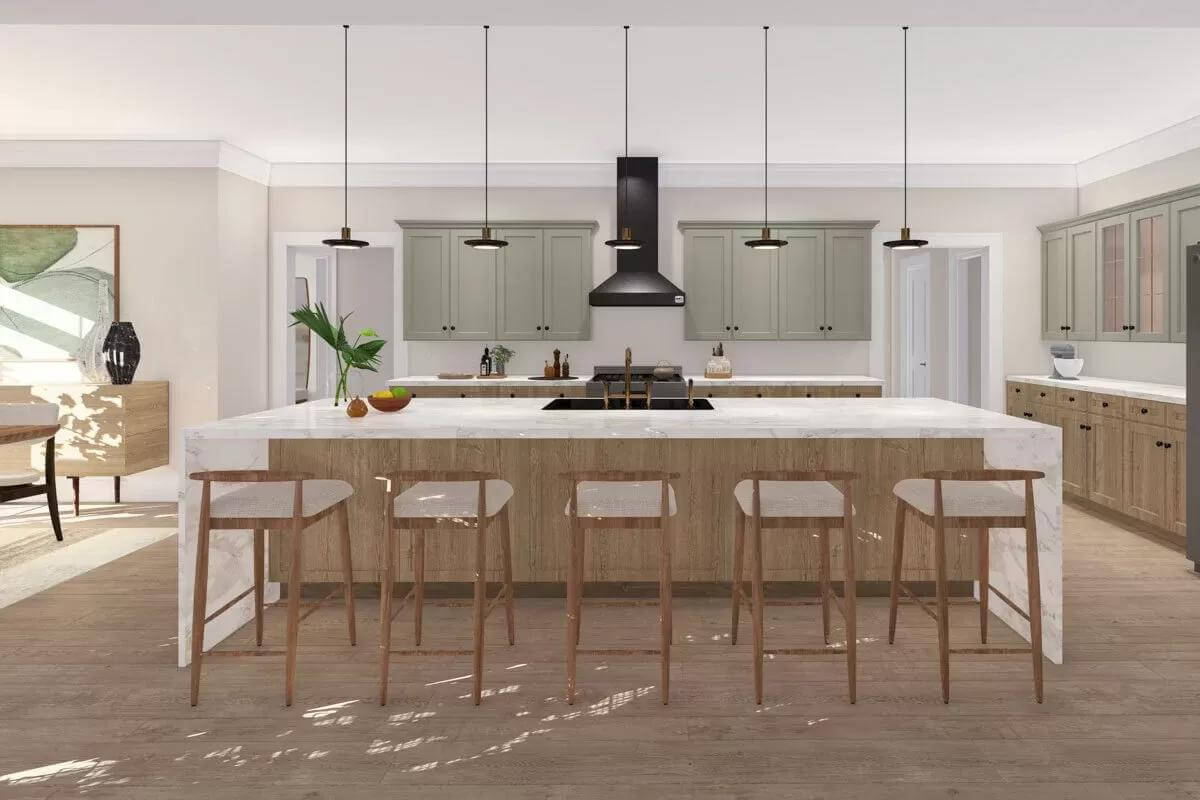 Kitchen with custom cabinetry and a waterfall island lined by cushioned stools.