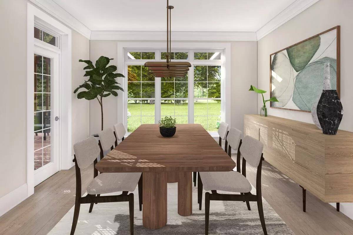 Dining room with a wooden dining set and a buffet table adorned by a large painting.