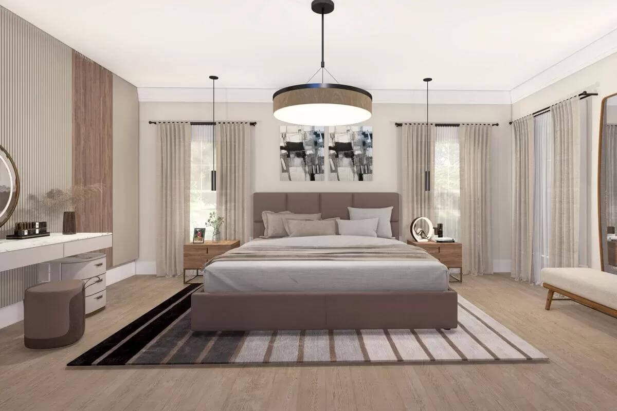 Primary bedroom with large windows and an upholstered bed over the striped area rug.
