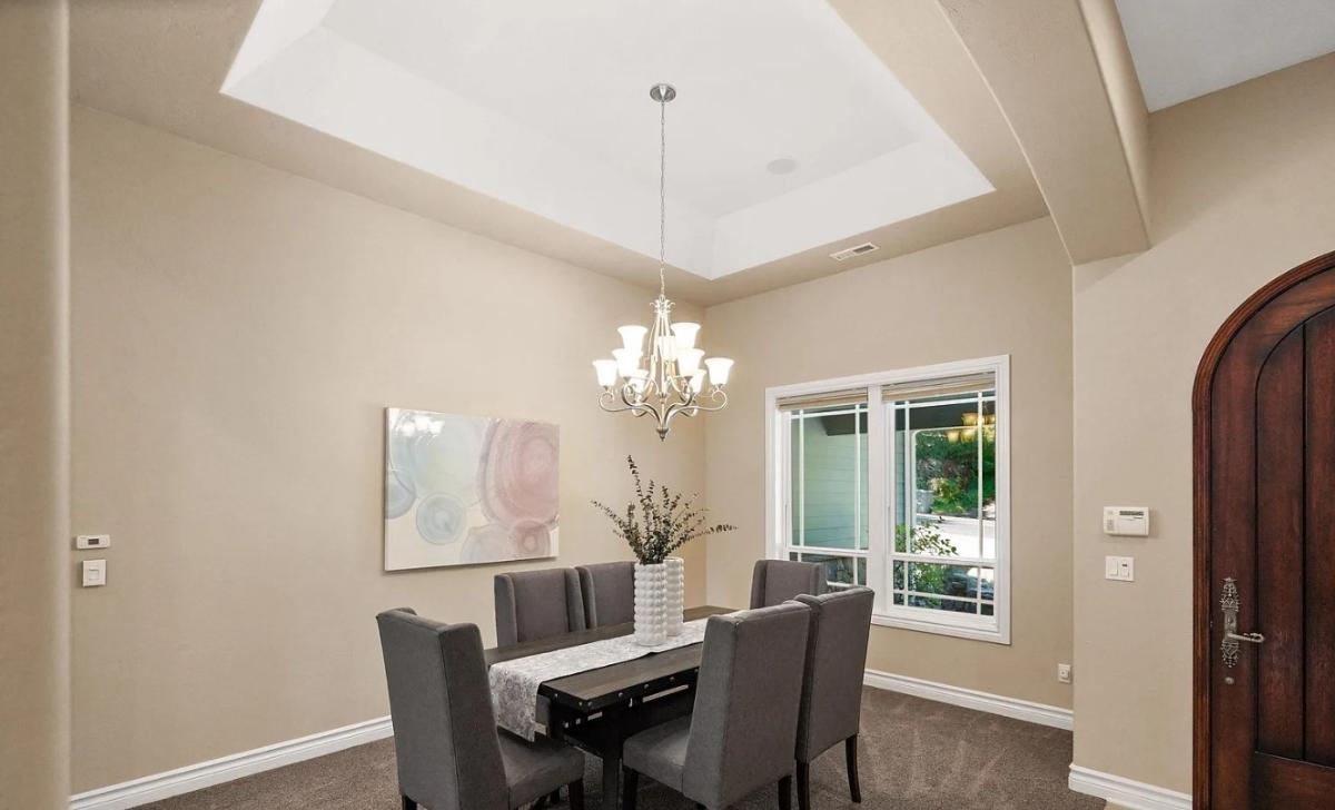 Dining room with a chandelier.