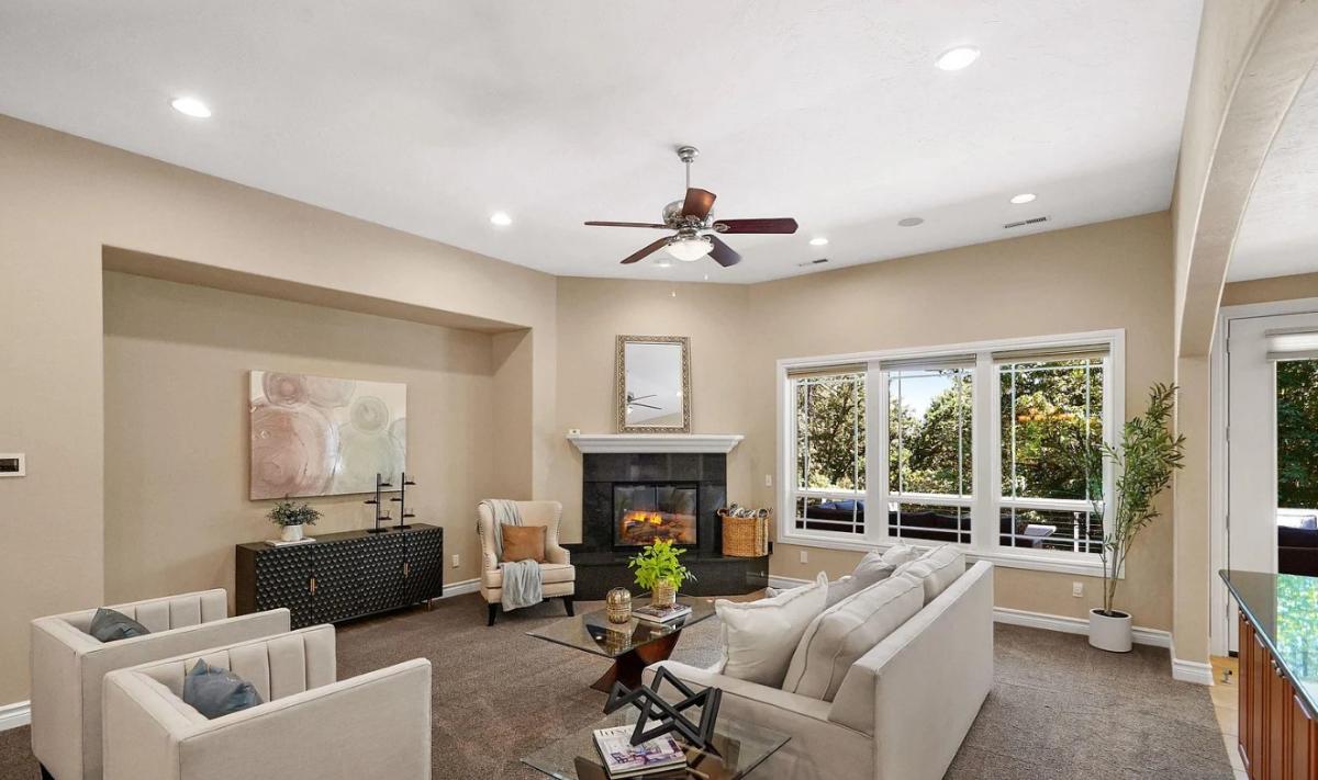Living room with couches and a fireplace.