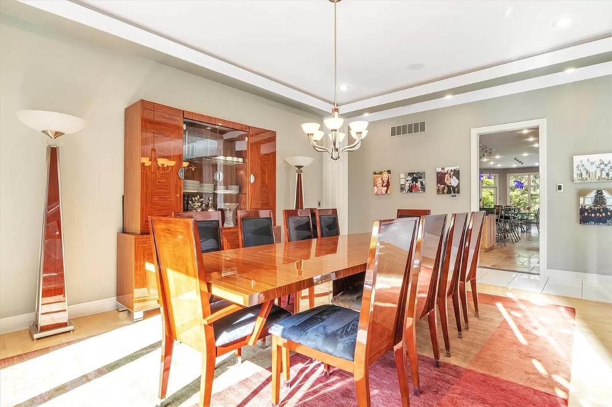 Dining room with a large wood table and chairs.