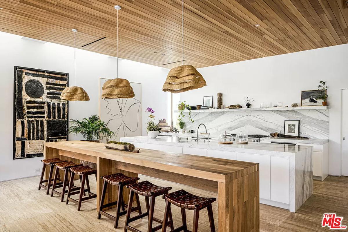 Kitchen with a counter breakfast bar and a center island prep area.