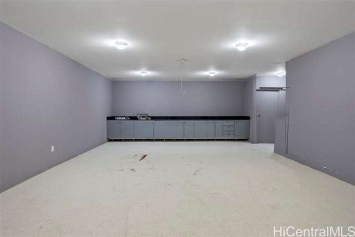 An empty room with purple walls.