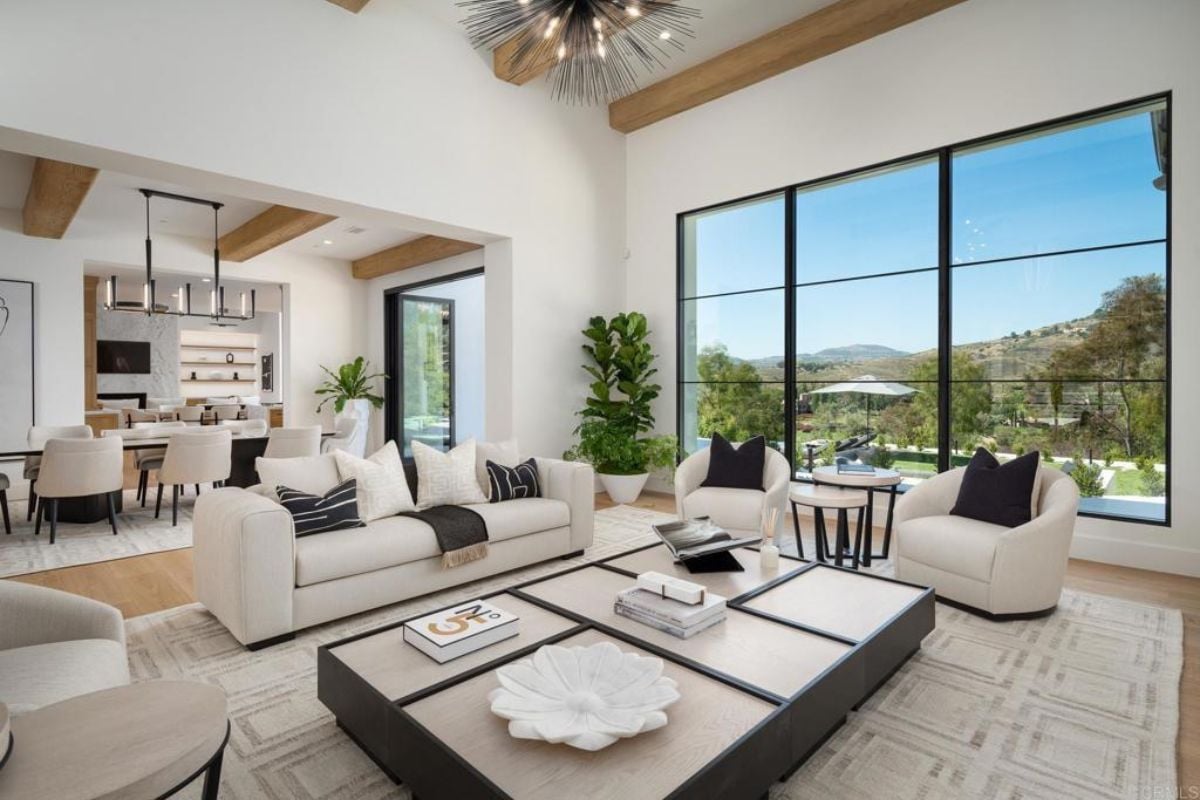 A great room with living space, a dining area, and a kitchen.