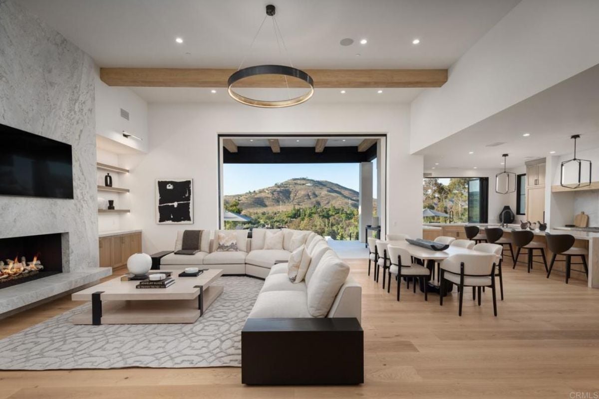 A great room with living space, a dining area, and a kitchen.