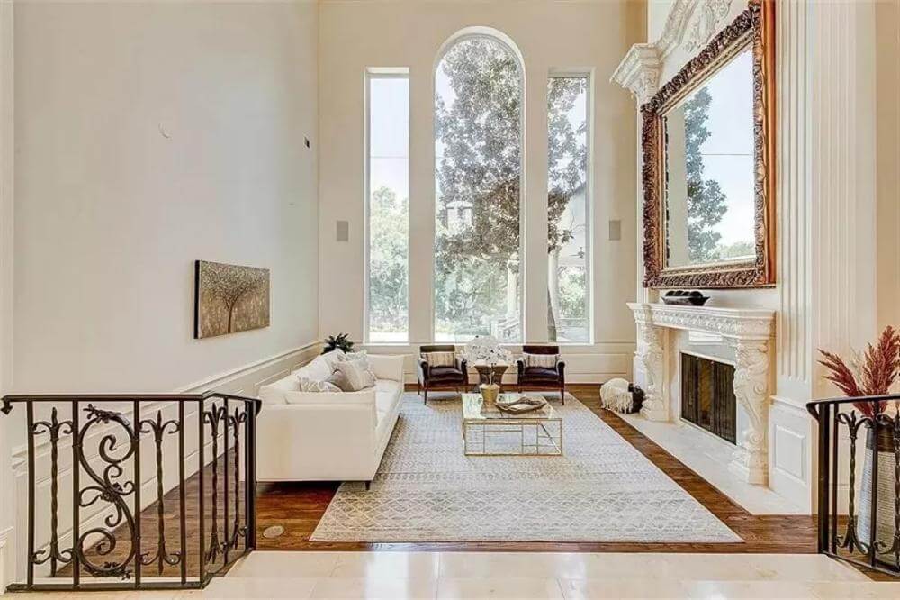 Elegant living room with soaring ceilings and fireplace